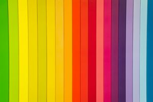 Blocks of color line up by gradient to form a rainbow.